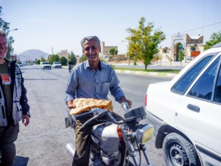 Kind Gentleman in Darab offering us some delicious flatbread...